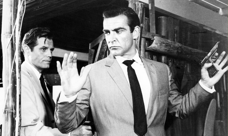 Jack Lord as Felix Leiter and Sean Connery as James Bond in Dr. No