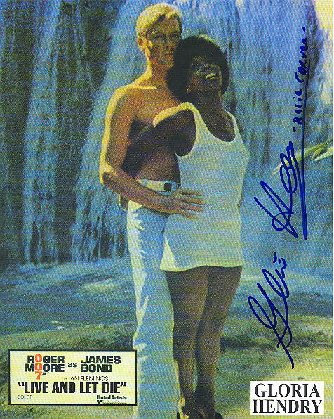 Gloria Hendry, pictured with Sir Roger Moore Signed 10x8 inch photo