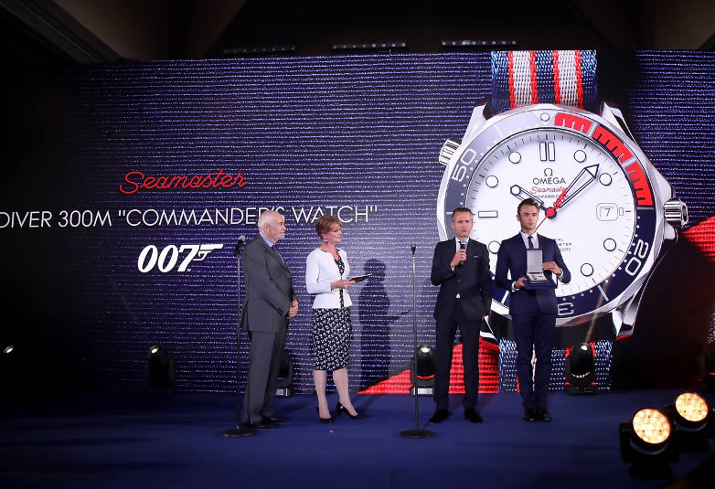 Michael G. Wilson and Samantha Bond with OMEGA President and CEO Raynald Aeschlimann in London